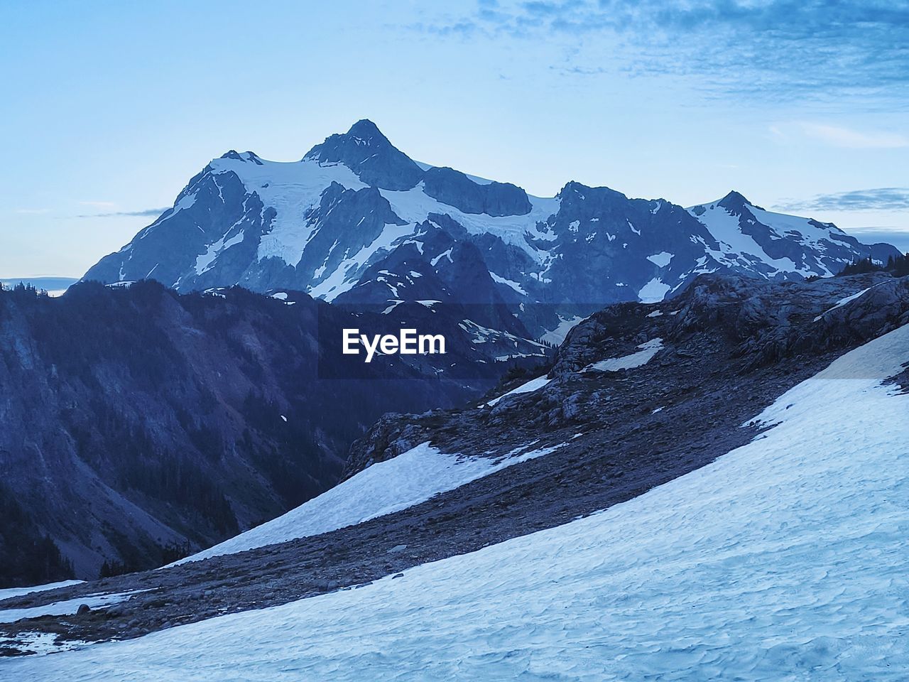 Snowcovered alpine landscape near mount baker at dusk 