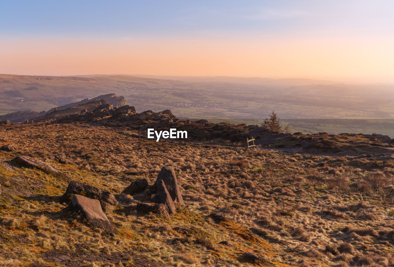 Scenic view of landscape against sky during sunset