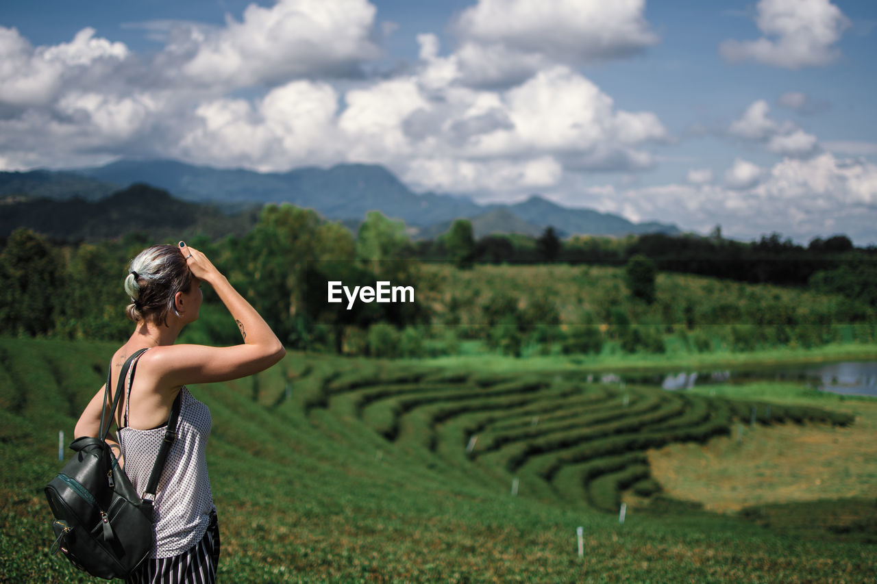 Woman standing on field