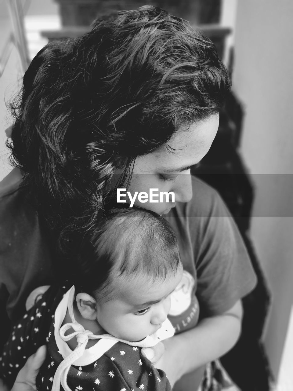 Woman with daughter sitting at home