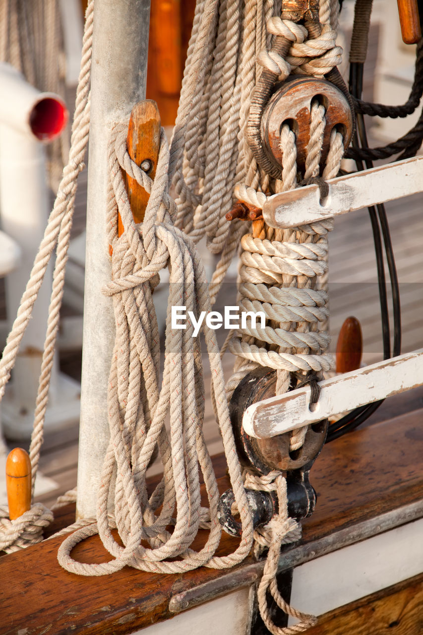 Close-up of ropes tied at ship