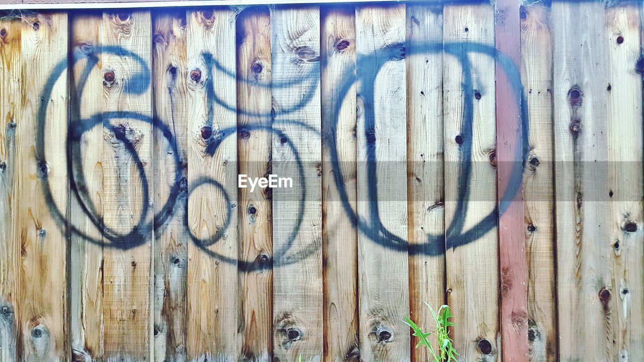 FULL FRAME SHOT OF RUSTY METALLIC STRUCTURE IN WOOD