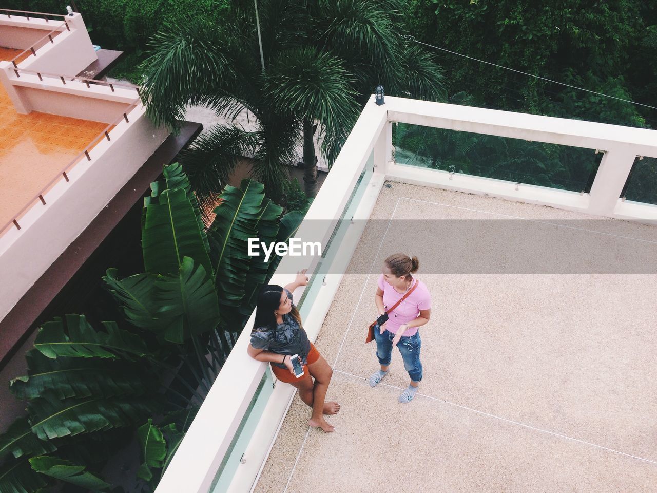 High angle view of women talking on terrace