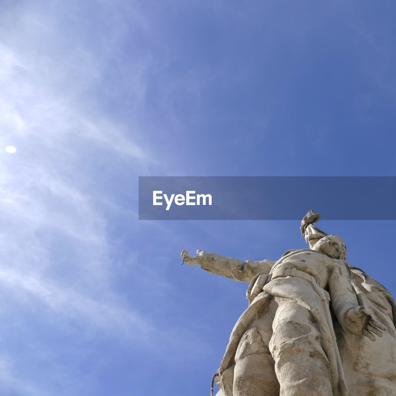 Low angle view of statue against sky