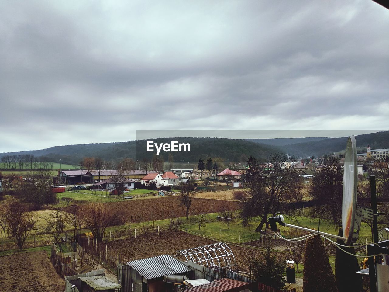 High angle view of houses and trees against sky