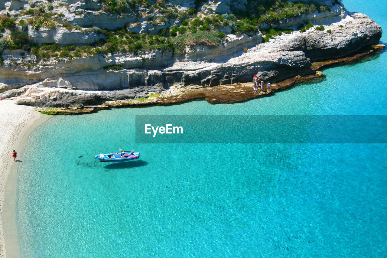 High angle view of sailboats on sea shore