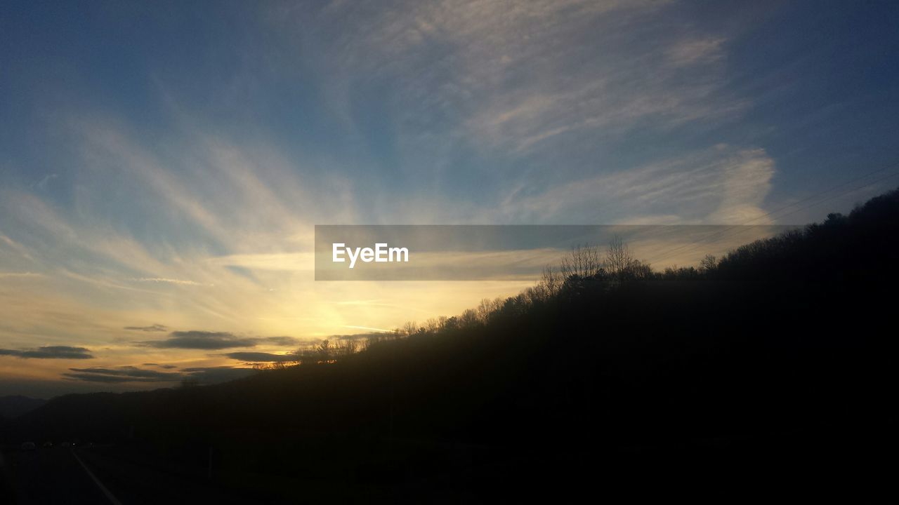 SCENIC VIEW OF LANDSCAPE AT SUNSET