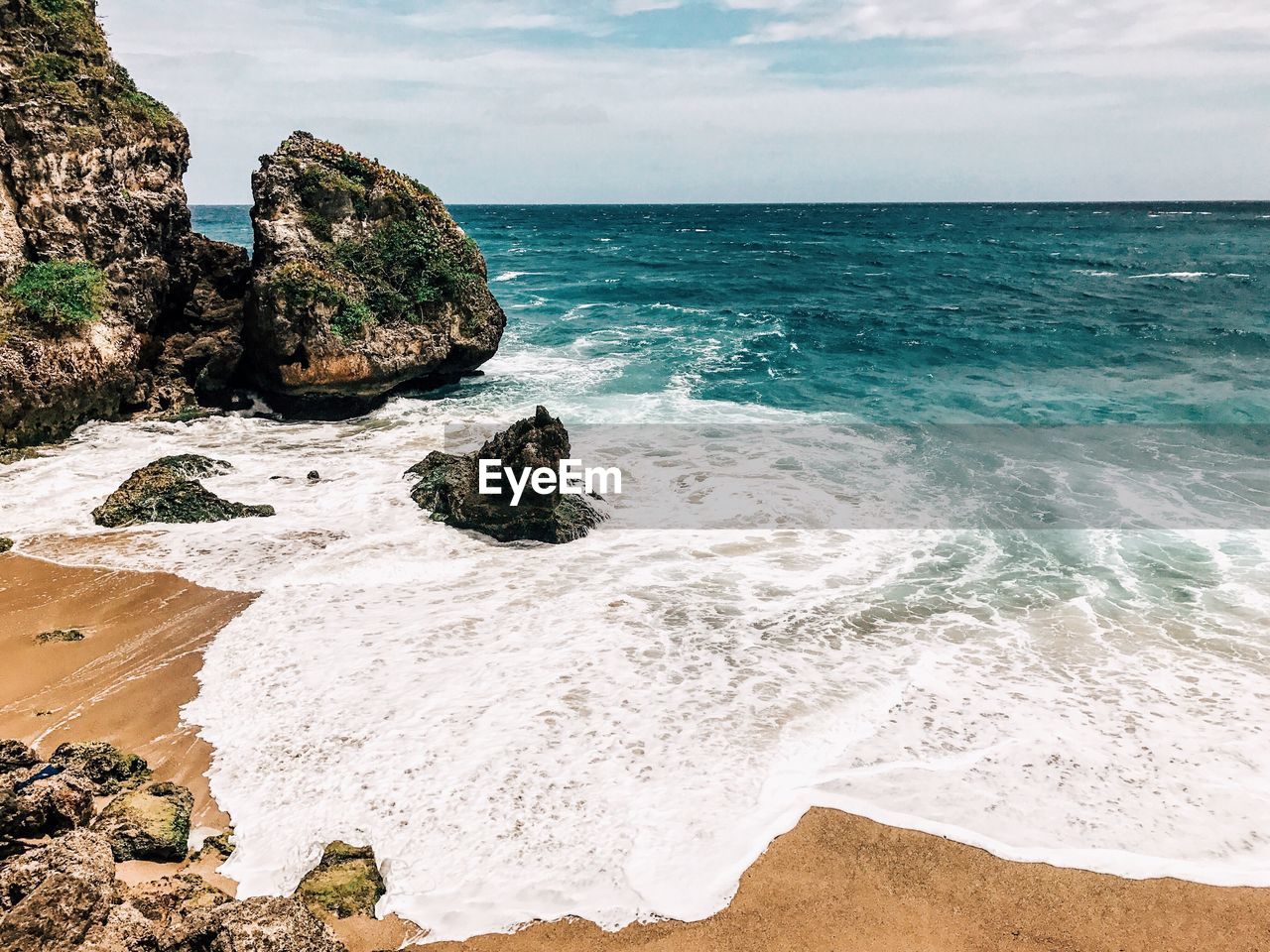 Scenic view of beach against sky