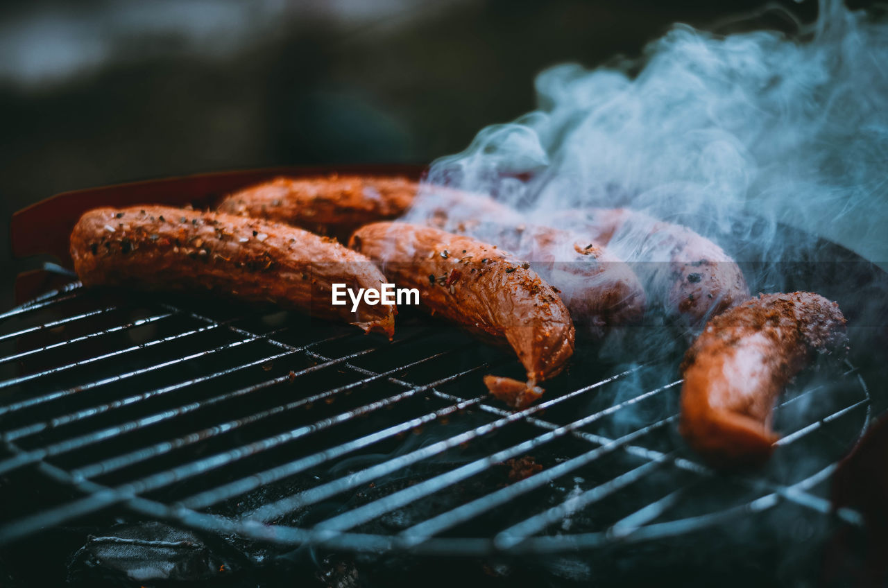 Close-up of sausages on barbecue grill