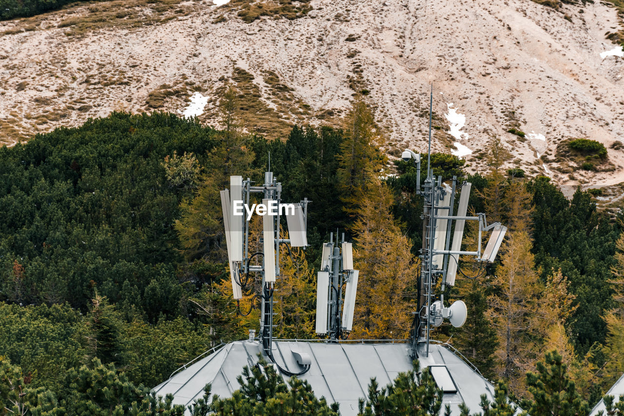 plant, tree, nature, no people, mountain, day, growth, high angle view, architecture, built structure, land, outdoors, beauty in nature, scenics - nature, green, mountain range, sunlight, tranquility, non-urban scene, snow