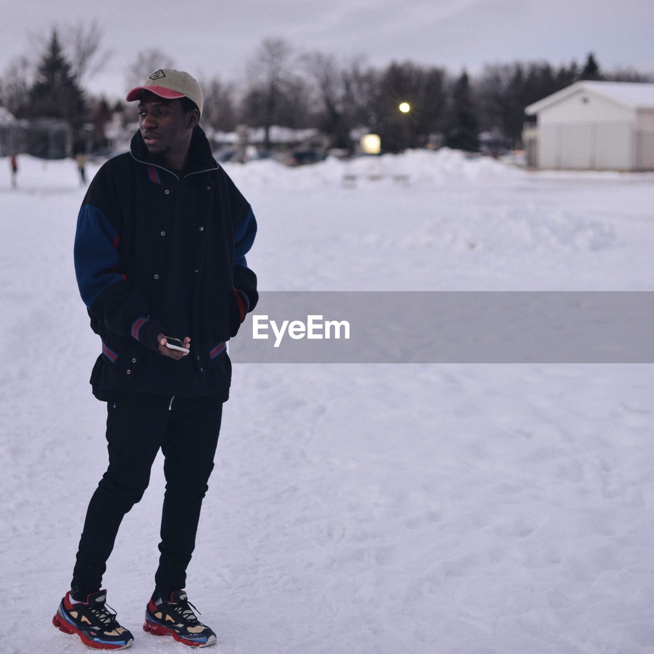 Man standing on snow covered landscape