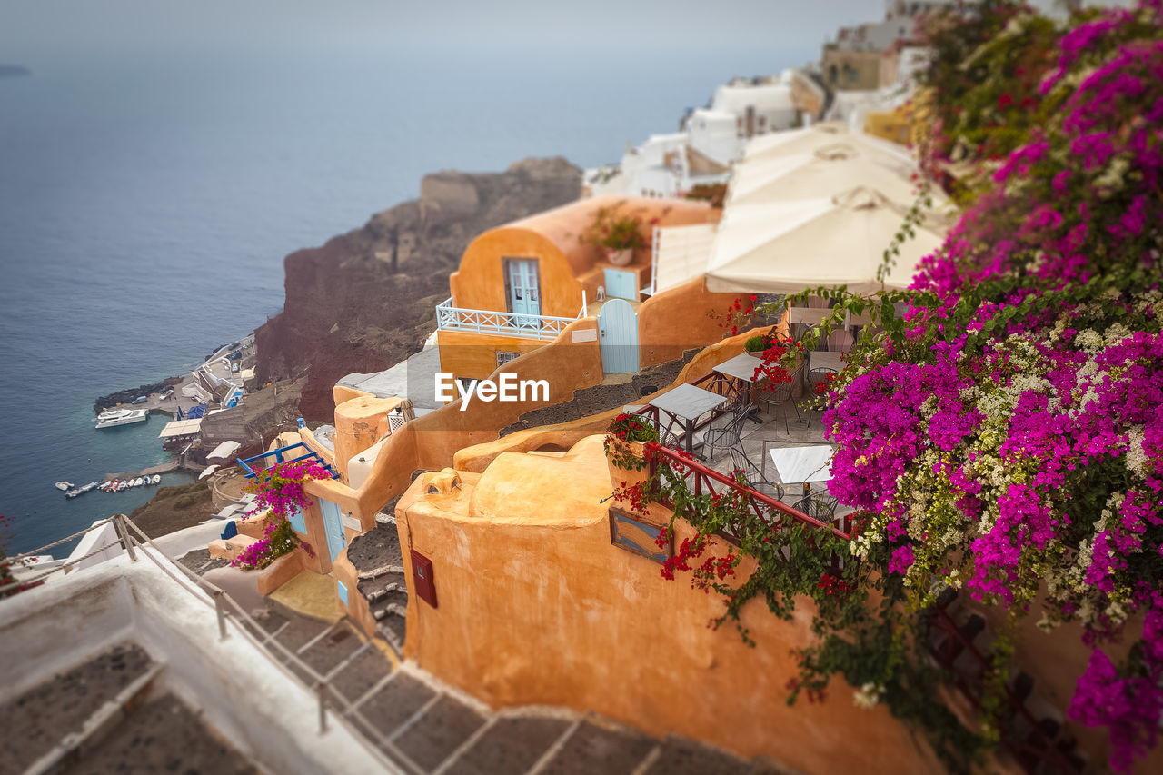 High angle view of buildings by sea