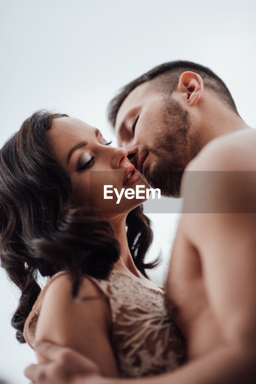 Side view of couple kissing