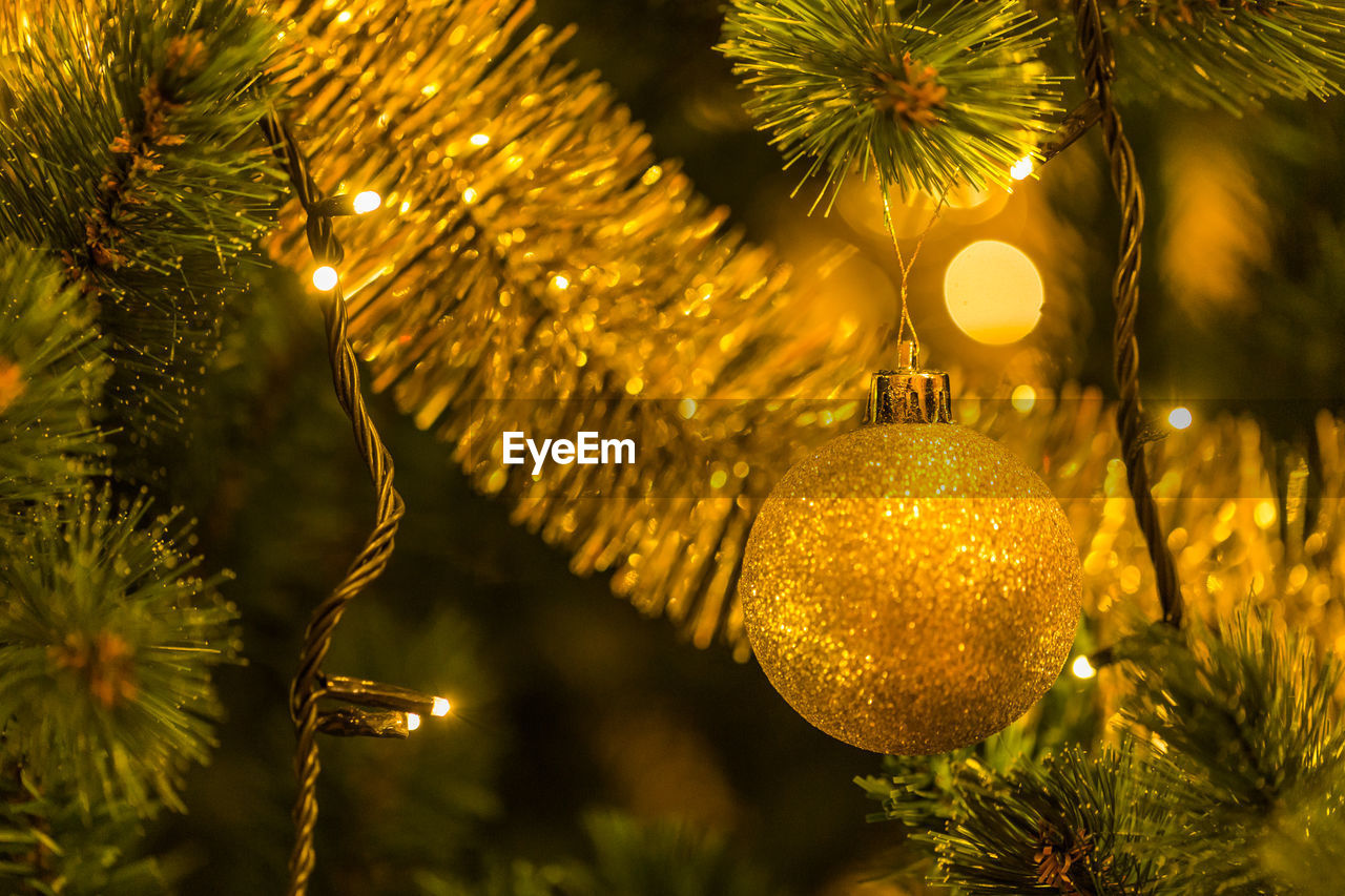 Close-up of christmas bauble on tree