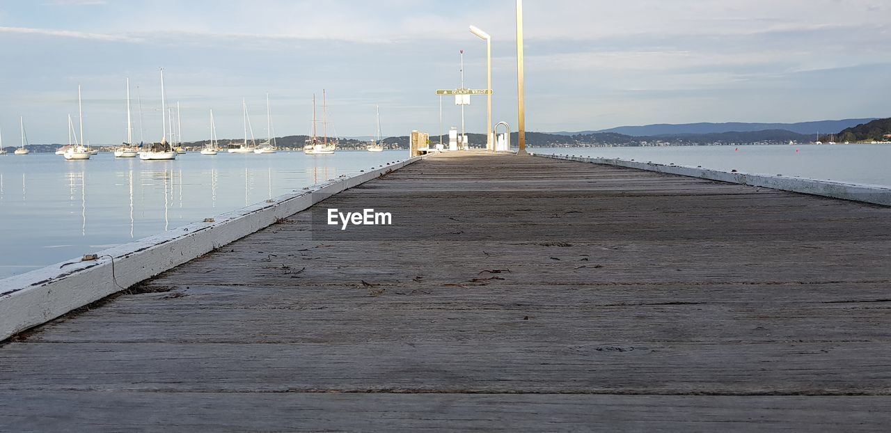 Pier over sea against sky