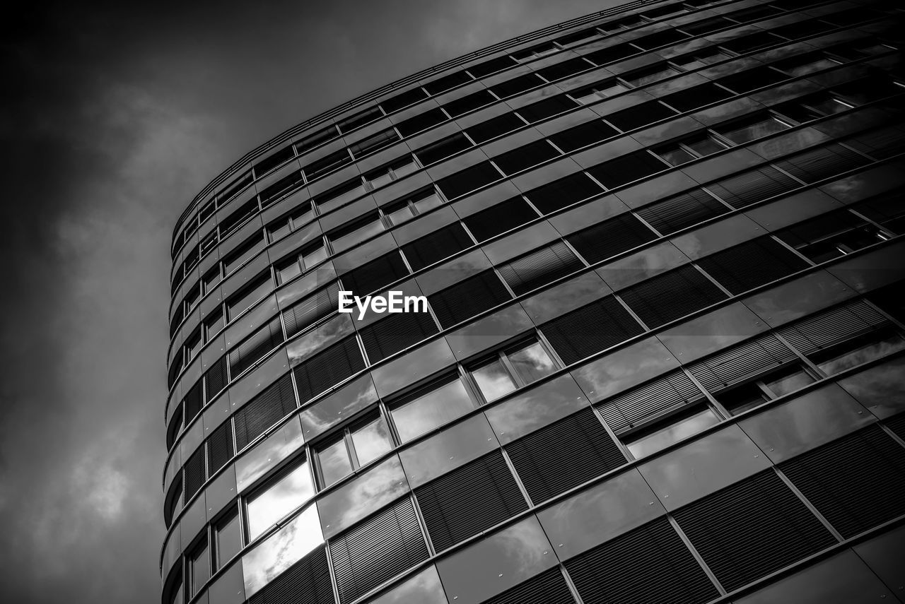 Low angle view of office building against sky