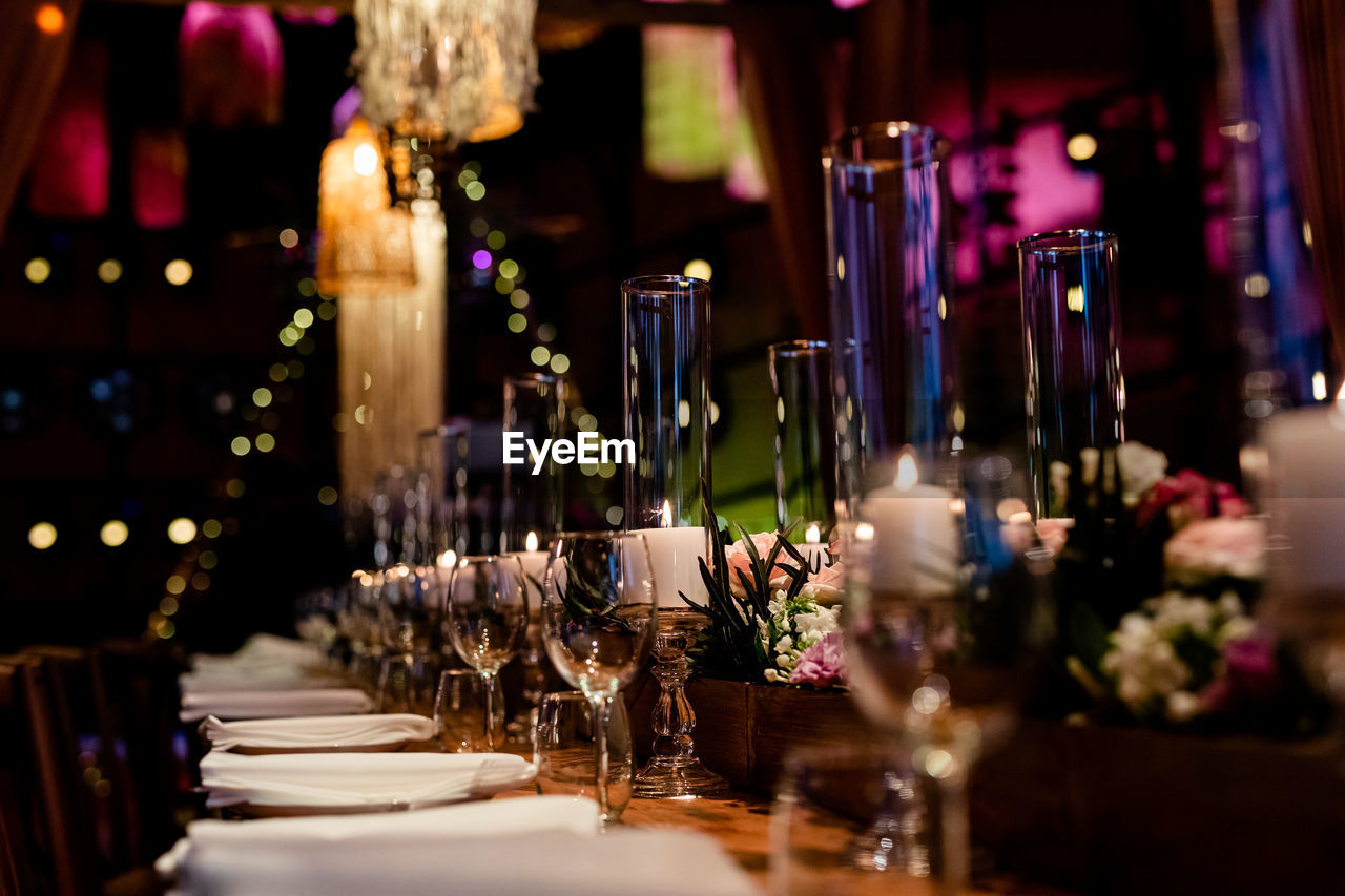 Luxury table settings for fine dining with and glassware, beautiful blurred background. 