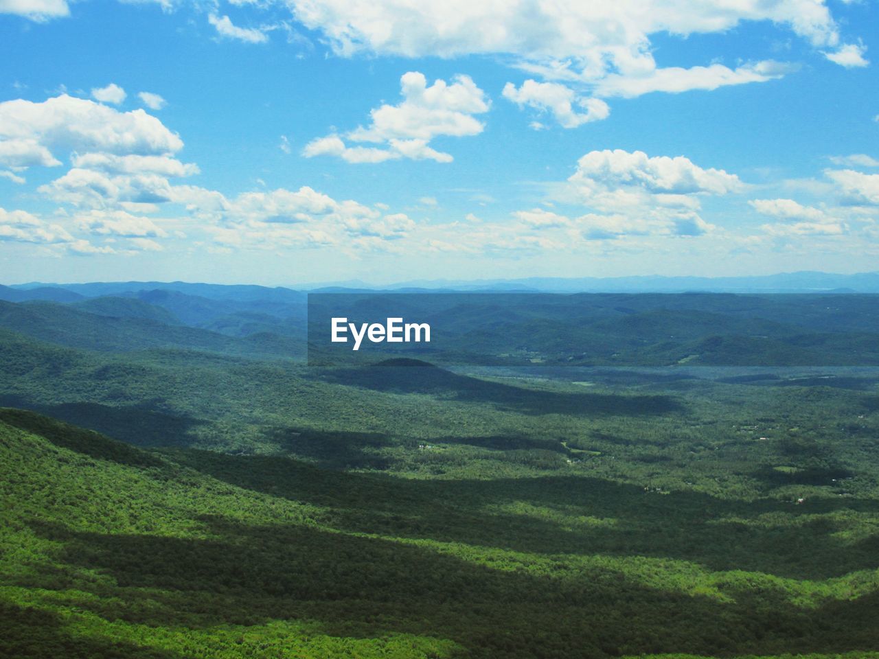 Scenic view of landscape against cloudy sky