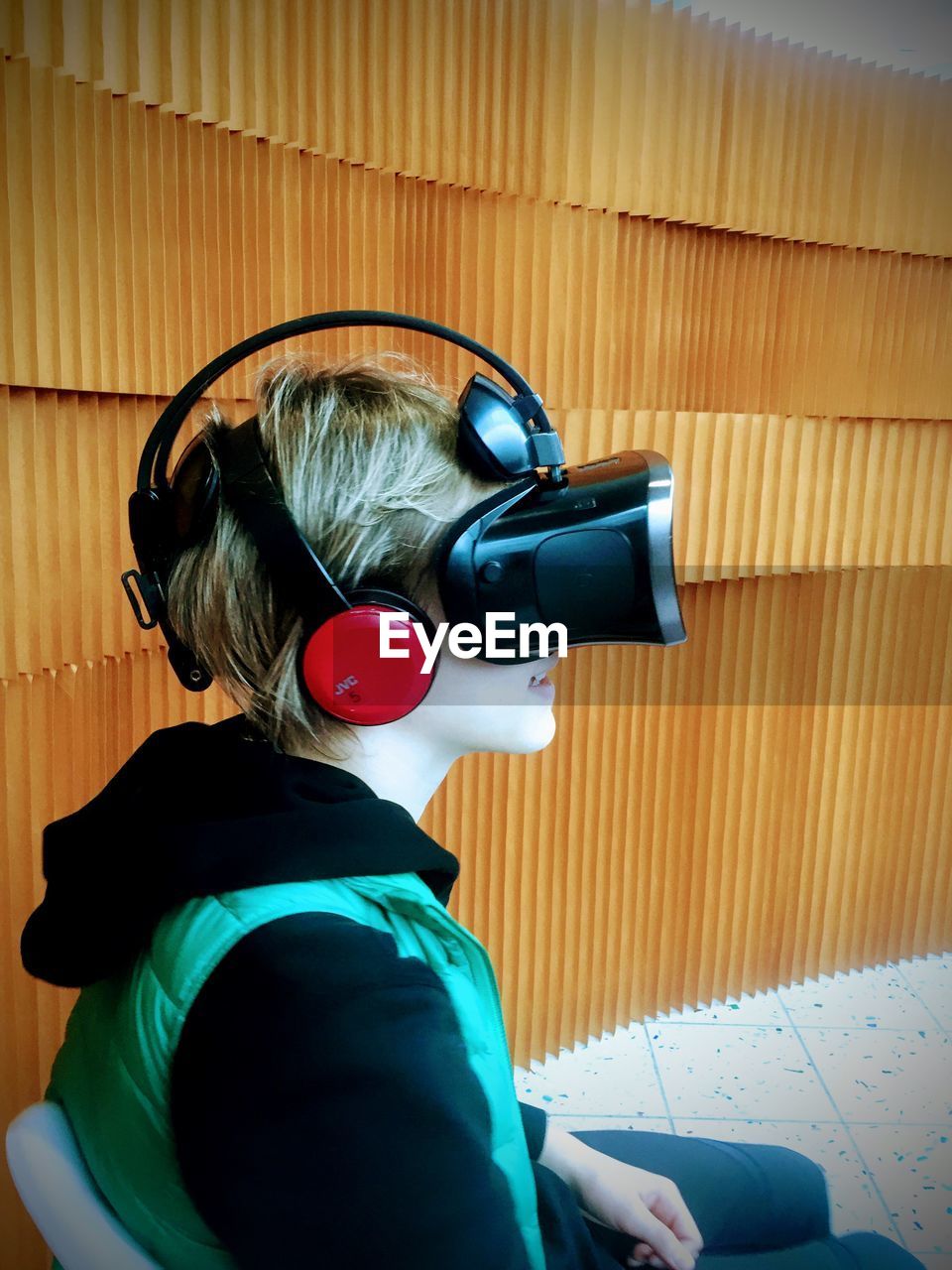 Side view of teenager using 3d glasses virtual reality