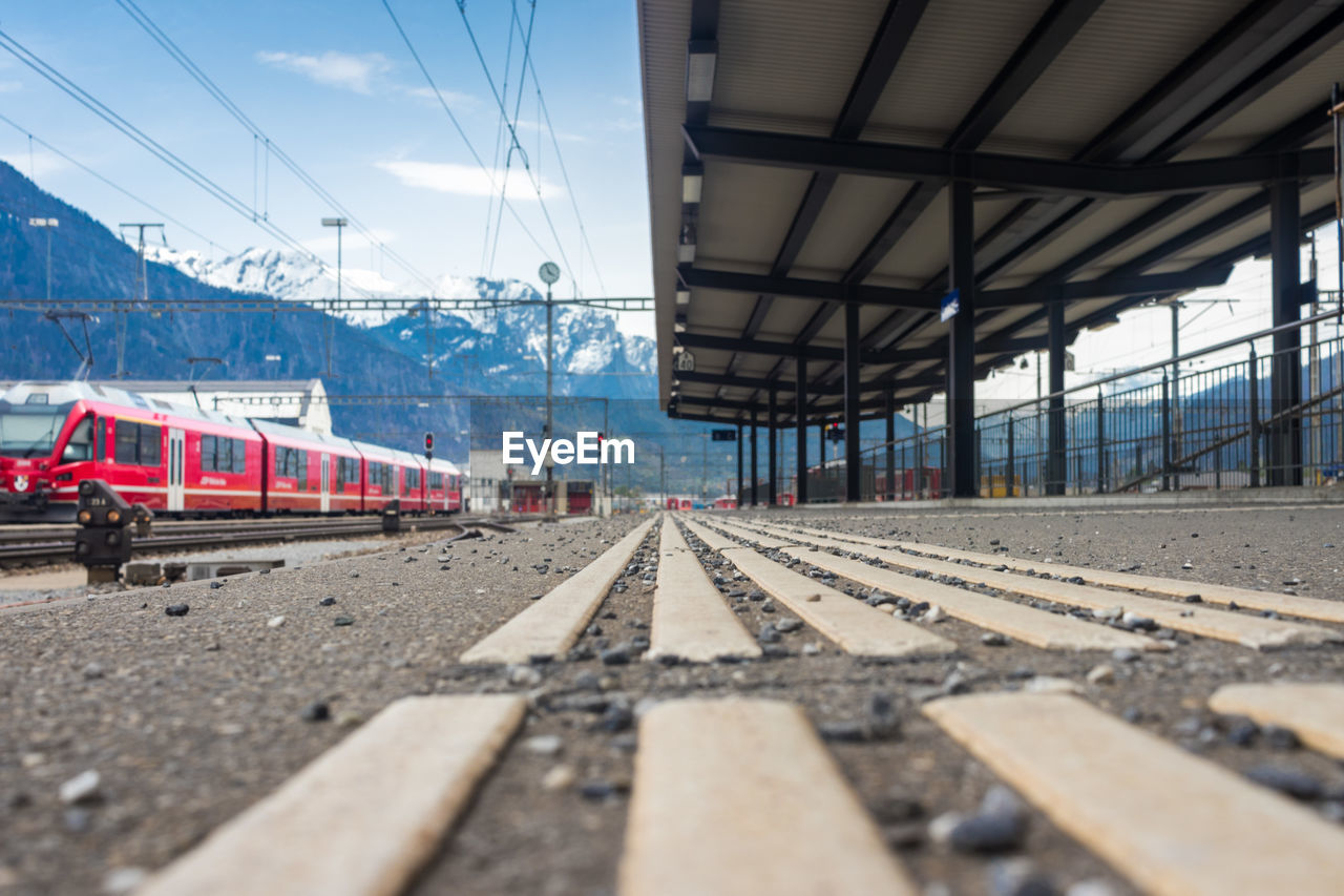 Train at railroad station against sky