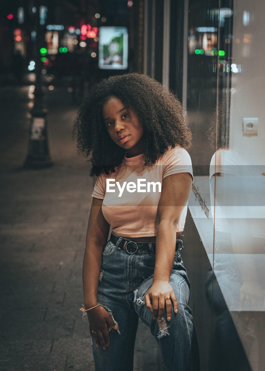 BEAUTIFUL WOMAN STANDING IN CITY