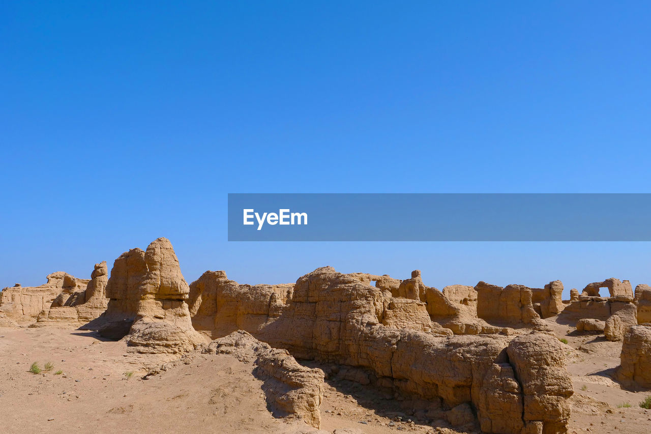 ROCKS AGAINST BLUE SKY