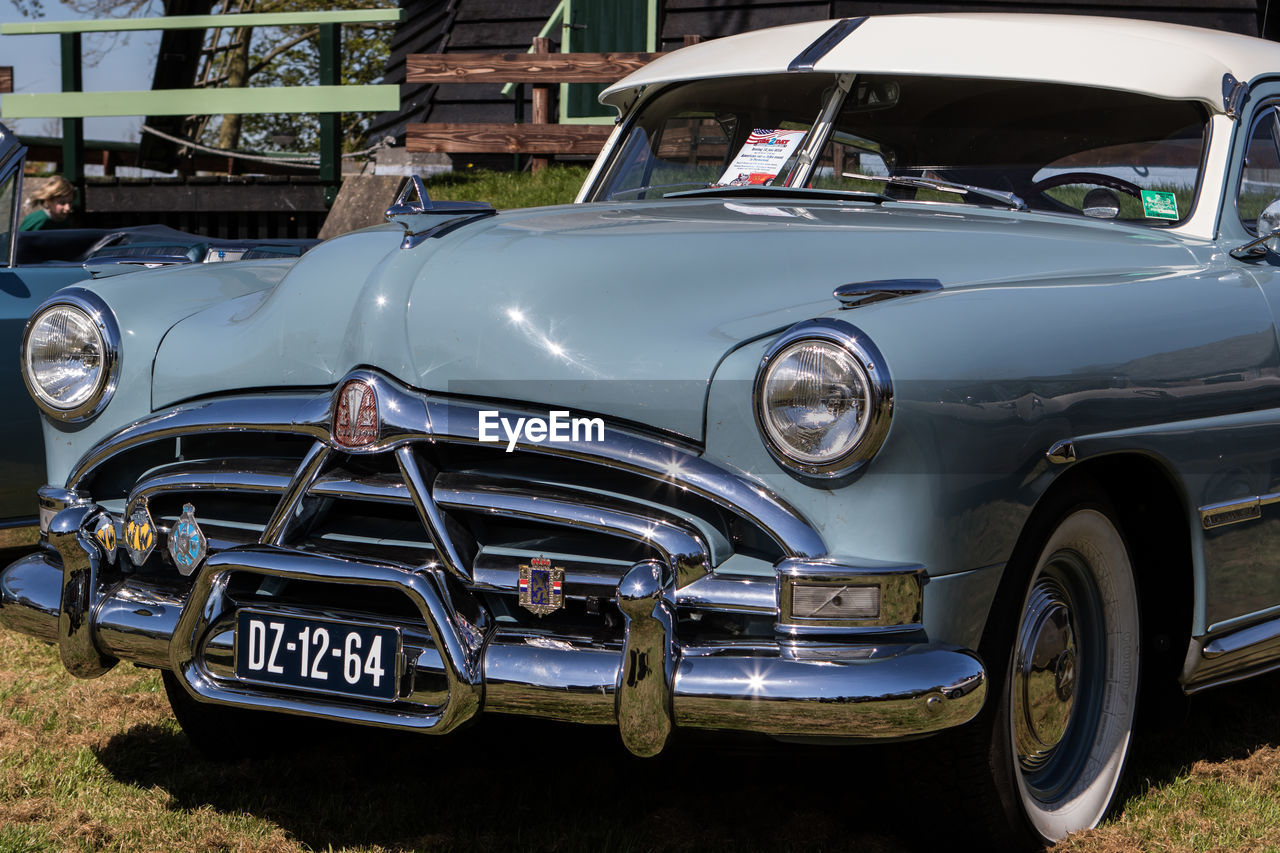 VINTAGE CAR PARKED ON ROAD