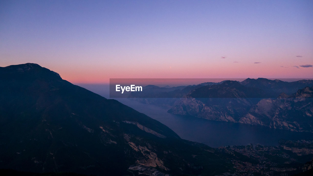 Scenic view of mountains against sky during sunset