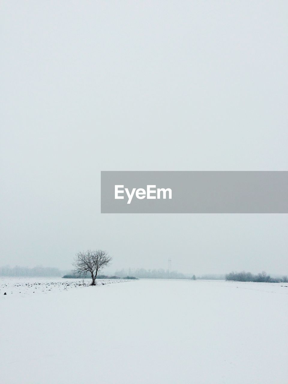 Scenic view of lake against sky during winter