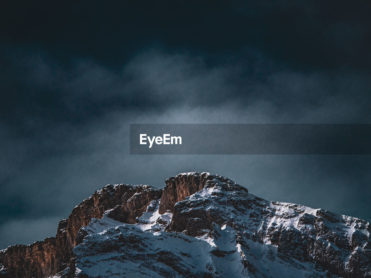 Scenic view of snowcapped mountains against sky during winter