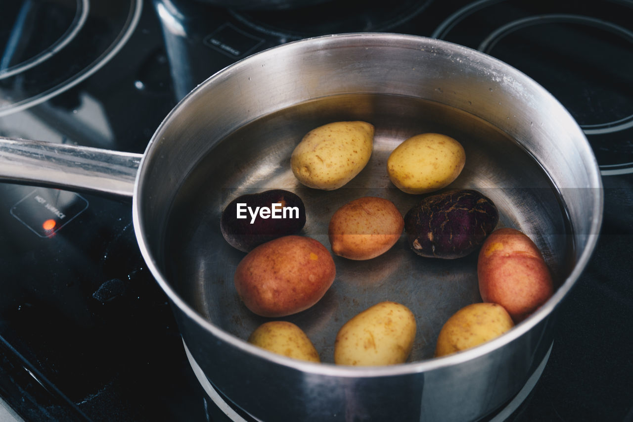 Close-up of vegetables in container on stove