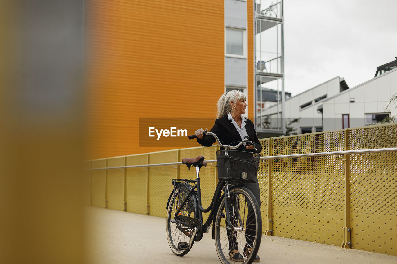 Senior woman with bicycle