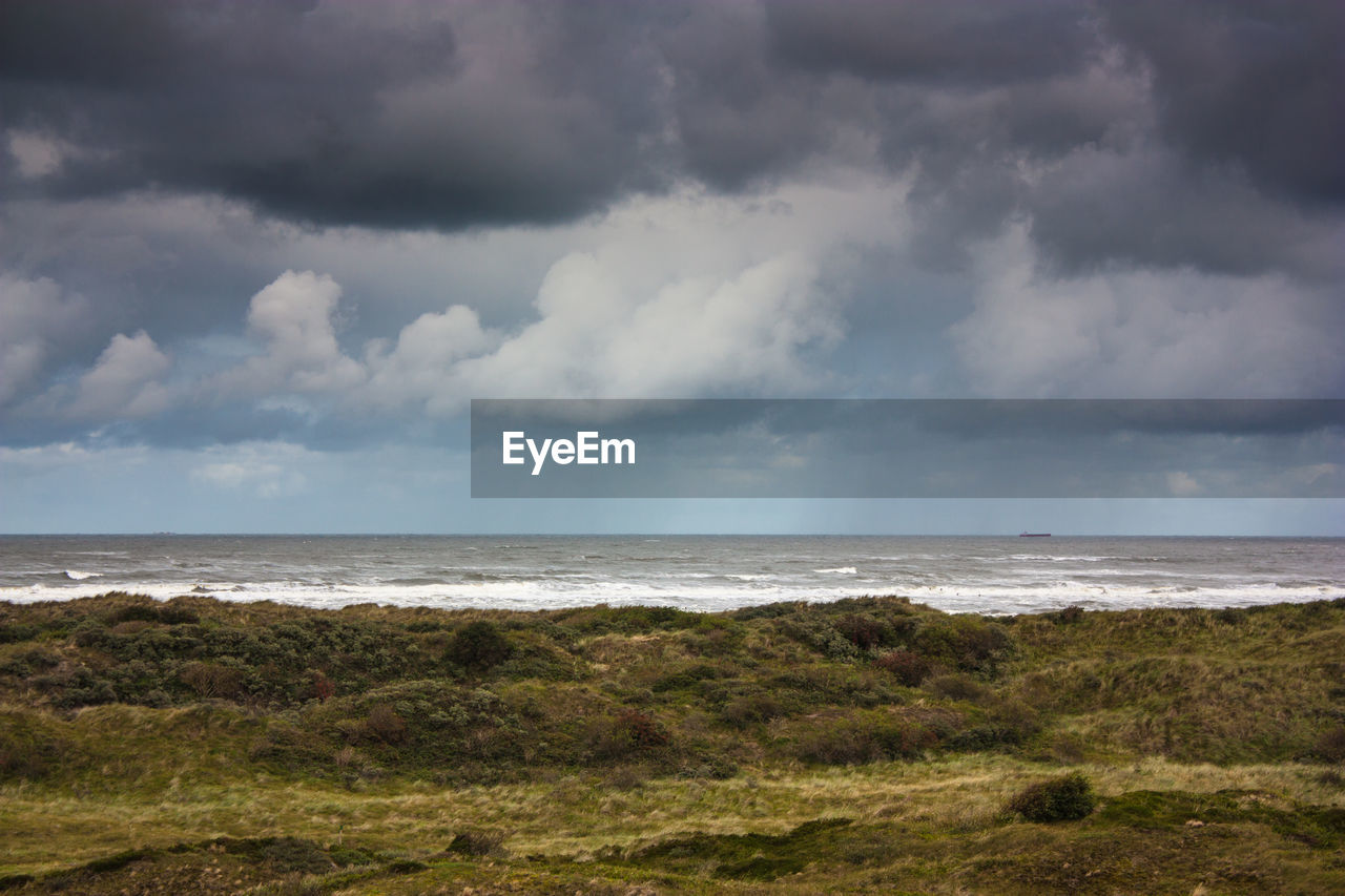 VIEW OF SEA AGAINST CLOUDY SKY