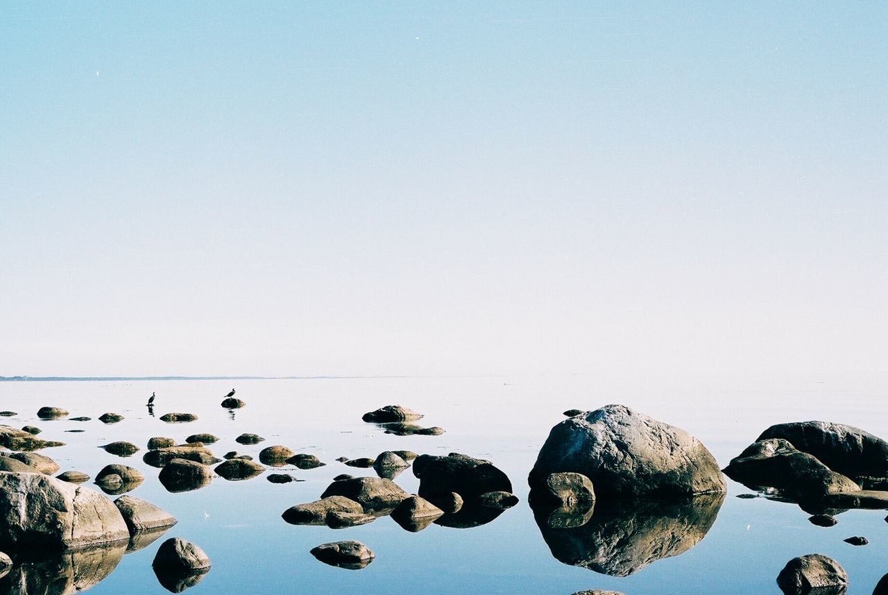 Scenic view of sea against clear sky