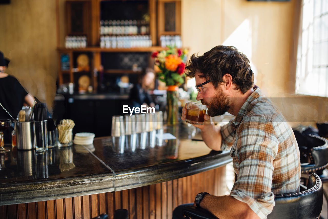 Man having cocktail in bar