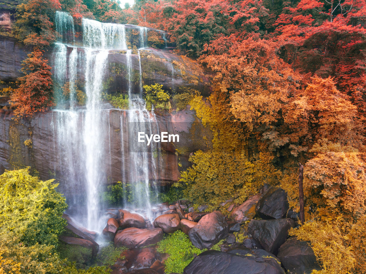 SCENIC VIEW OF WATERFALL DURING AUTUMN