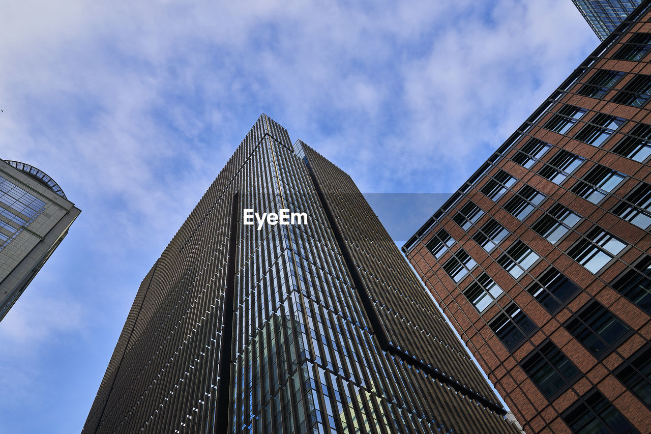 Low angle view of skyscraper against sky