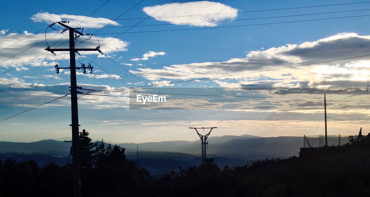 LOW ANGLE VIEW OF ELECTRICITY PYLON AGAINST SKY