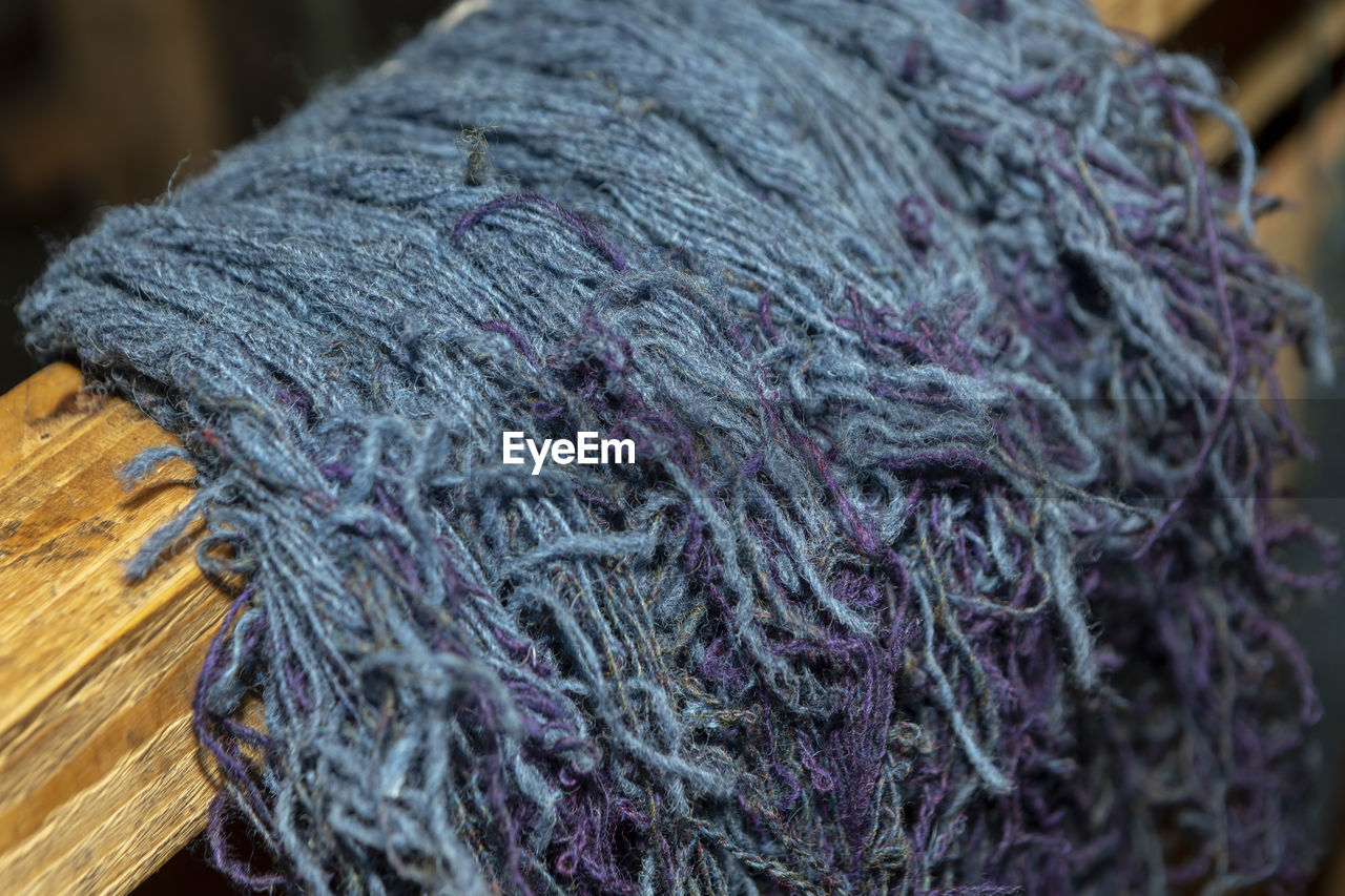 High angle view of string on wood