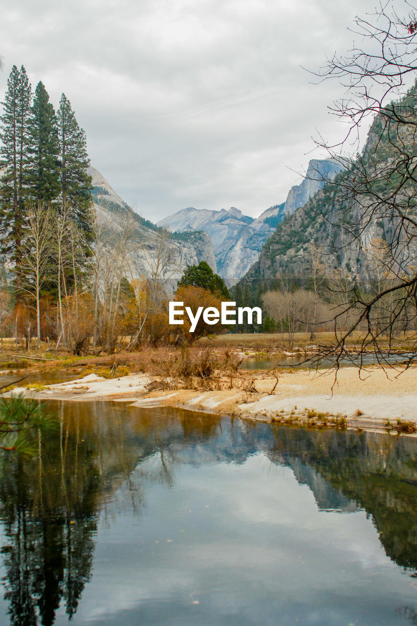 Scenic view of calm lake at forest during autumn