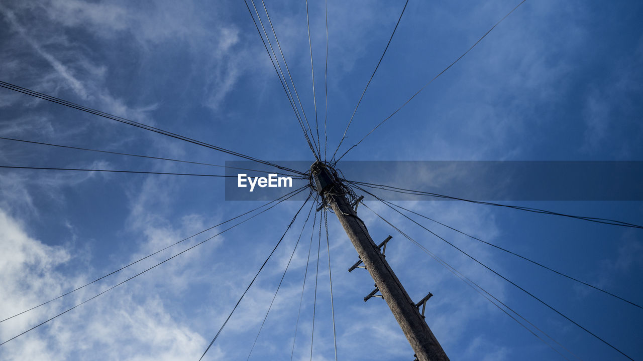 Low angle view of telephone line against sky