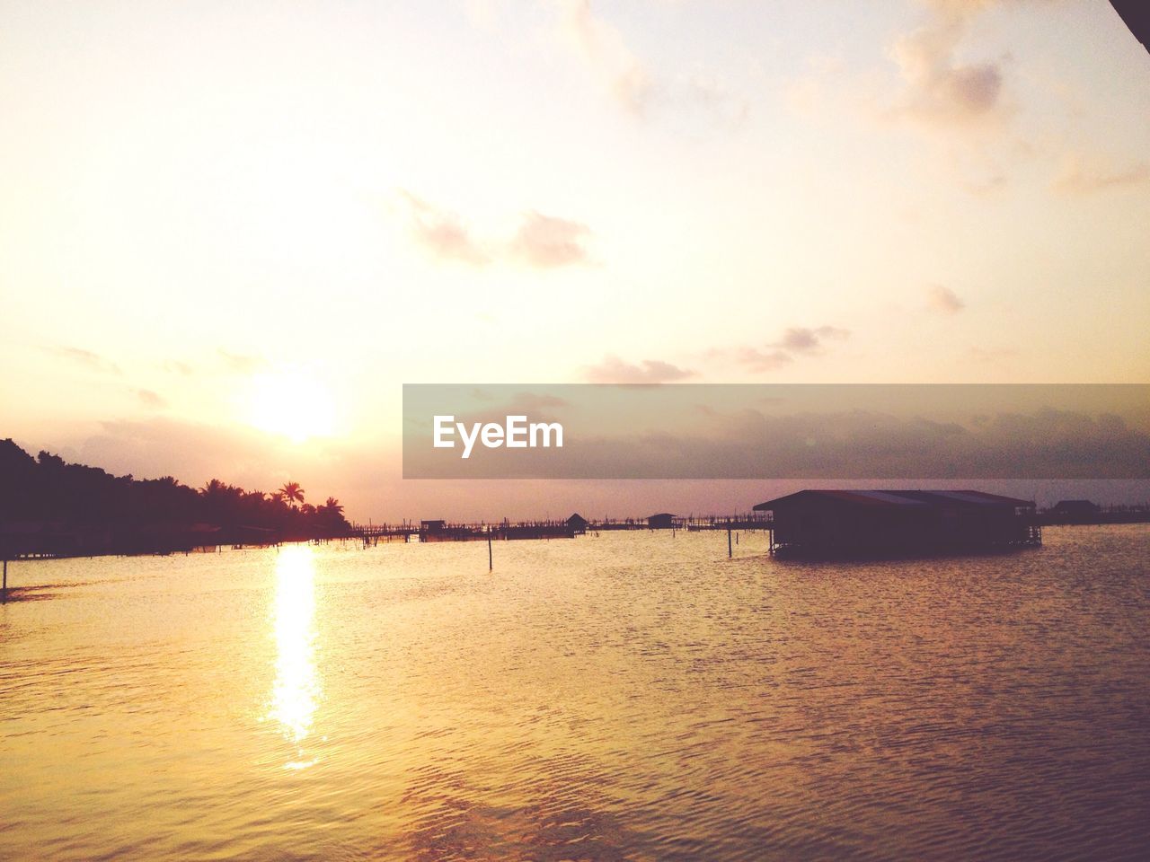 Scenic view of sea against sky at sunset