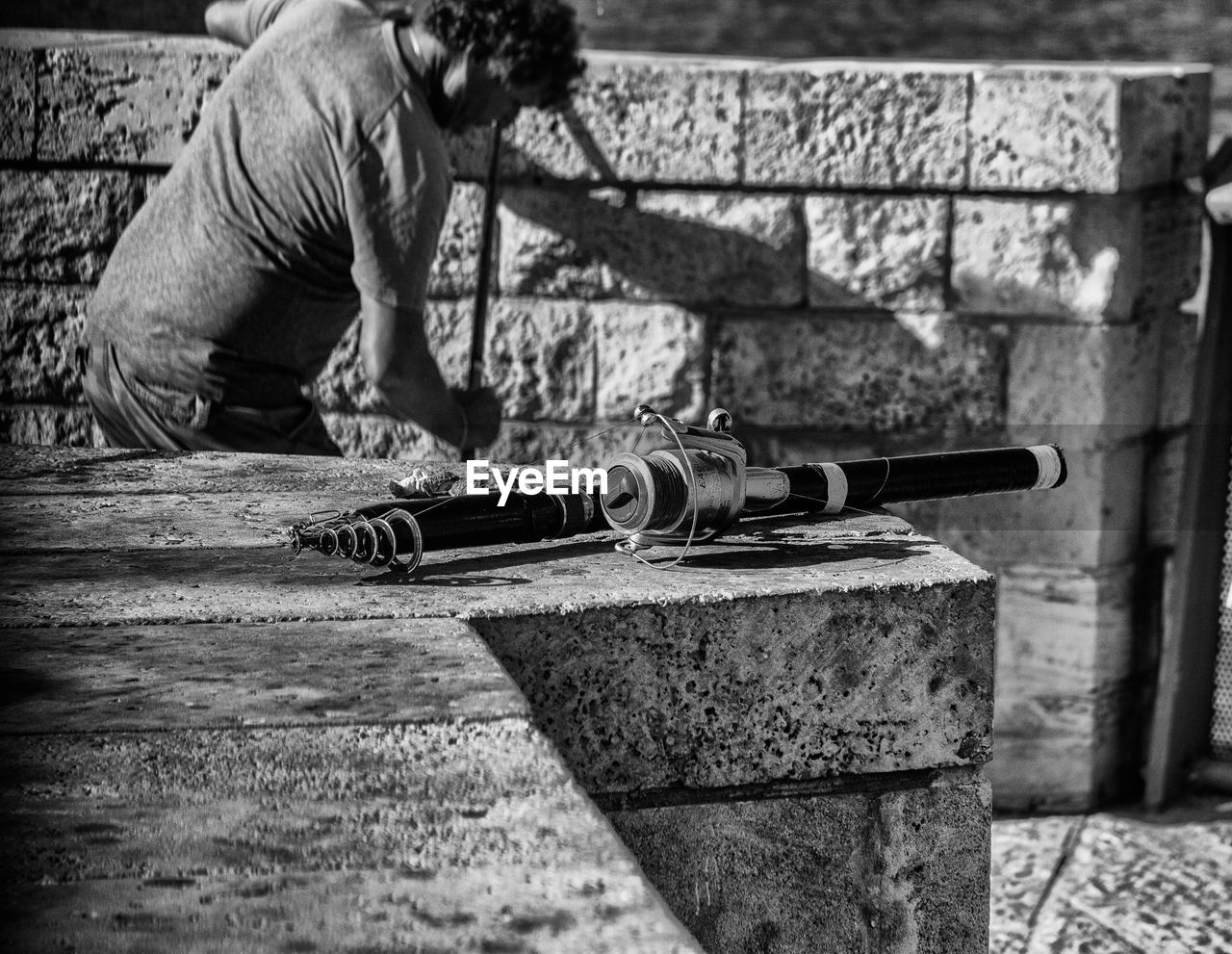 MAN WORKING AT CART