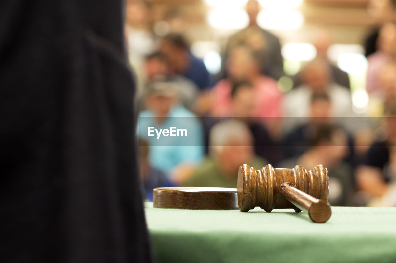 Close-up of gavel on table