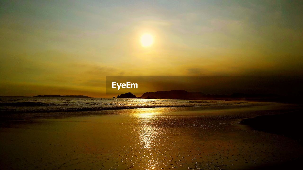 Scenic view of sea against sky at sunset