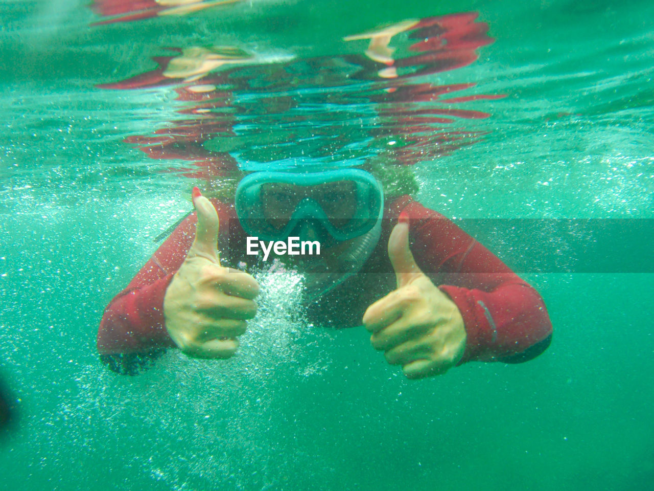 GIRL SWIMMING IN POOL