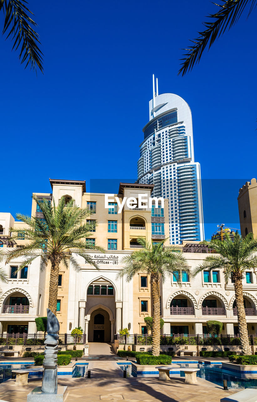 BUILDINGS AGAINST BLUE SKY