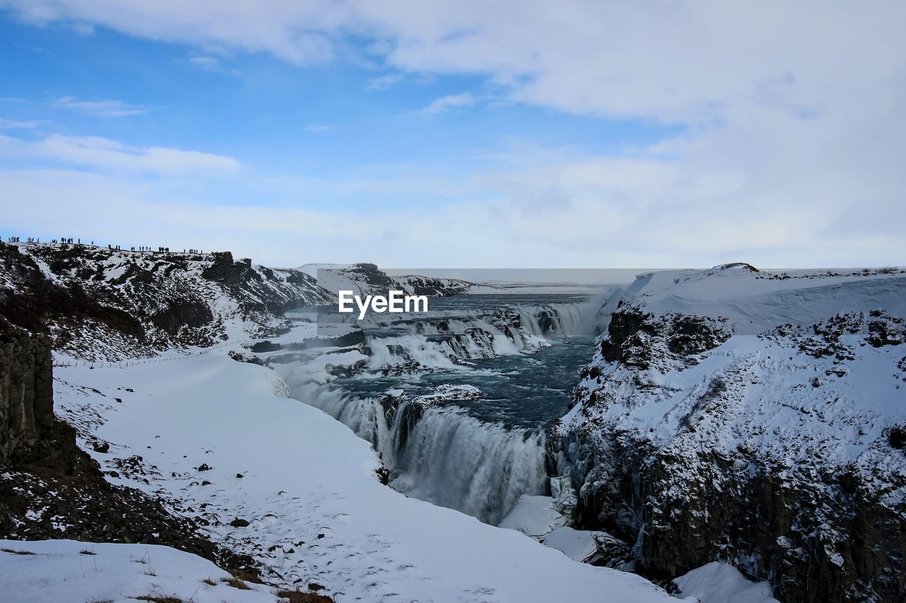 Scenic view of sea against cloudy sky