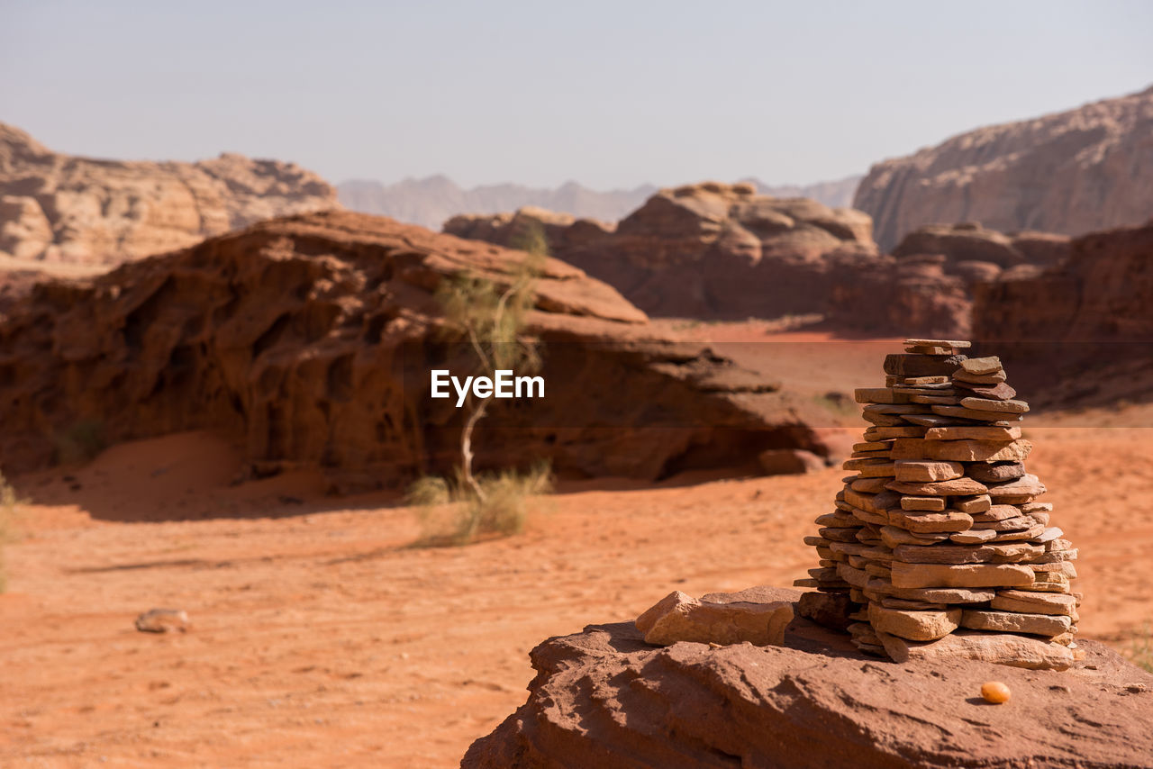 Close-up of rocks stacked at desert