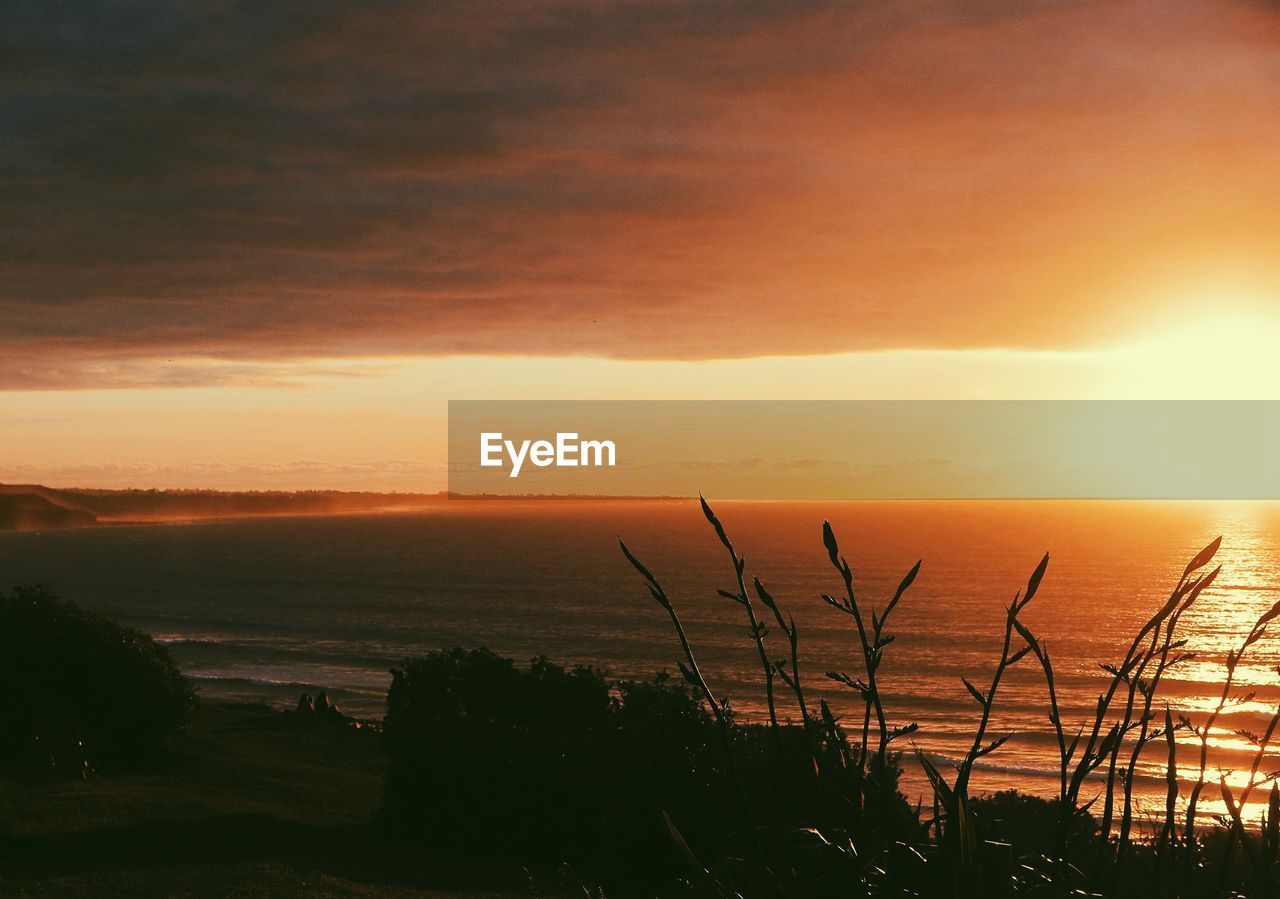 SCENIC VIEW OF SEA DURING SUNSET